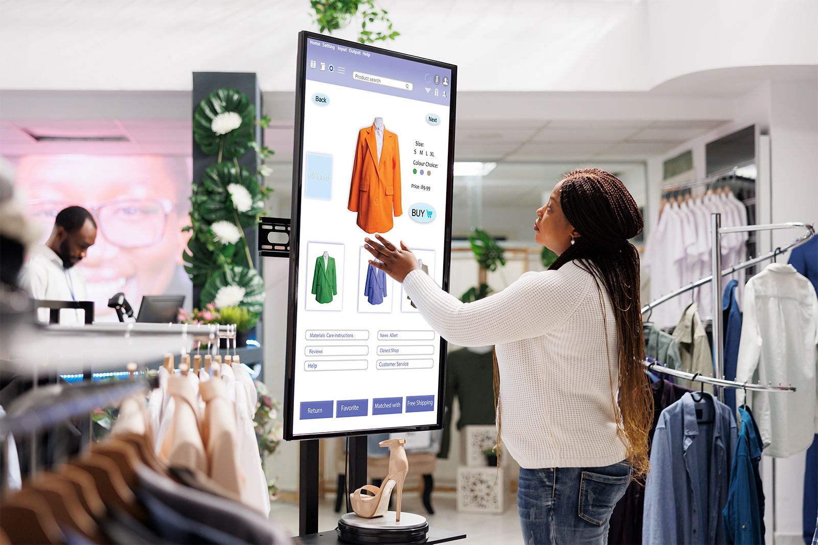 Pantalla táctil de catálogo digital en un local de indumentaria